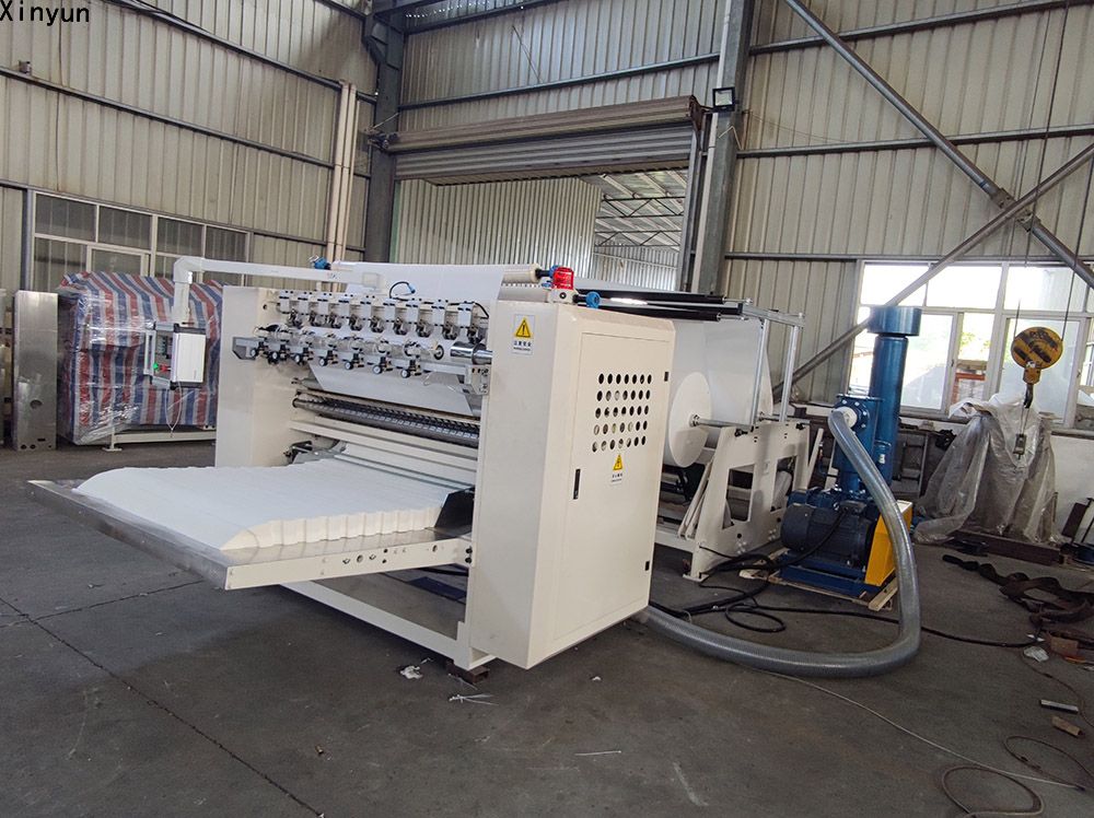 Automatic embossing folding facial tissue paper making machine